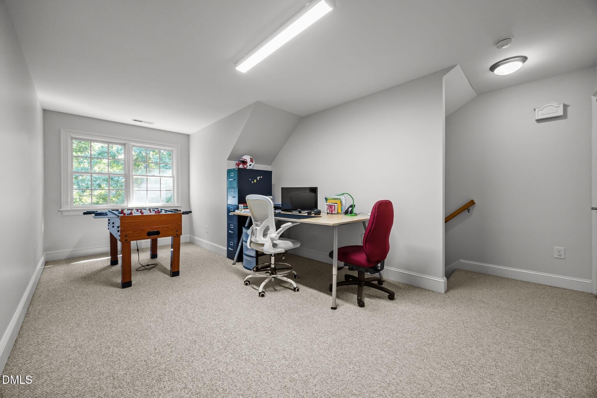 3901 Orchard Point Court Apex, NC 27539 - Photo 42 of 53 a view of a workspace with furniture and a window