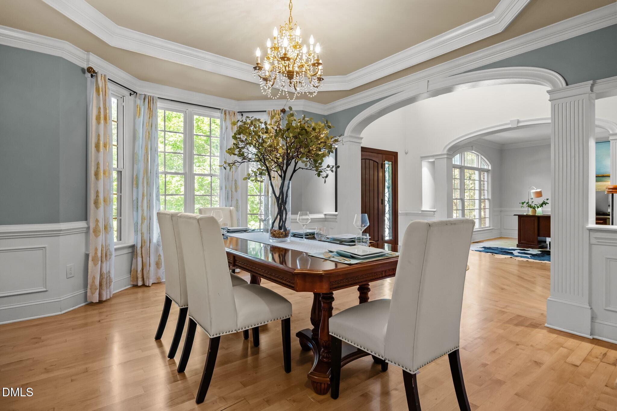 3901 Orchard Point Court Apex, NC 27539 - Photo 6 of 53 a view of a dining room with furniture window and wooden floor