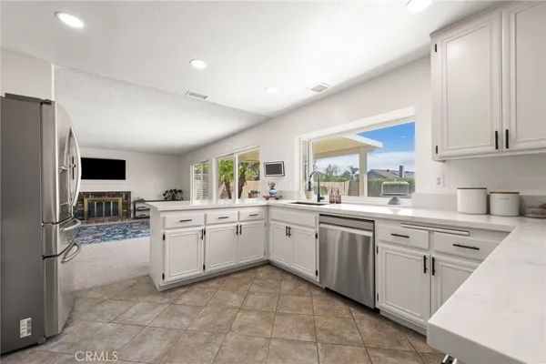 a kitchen with sink cabinets and microwave