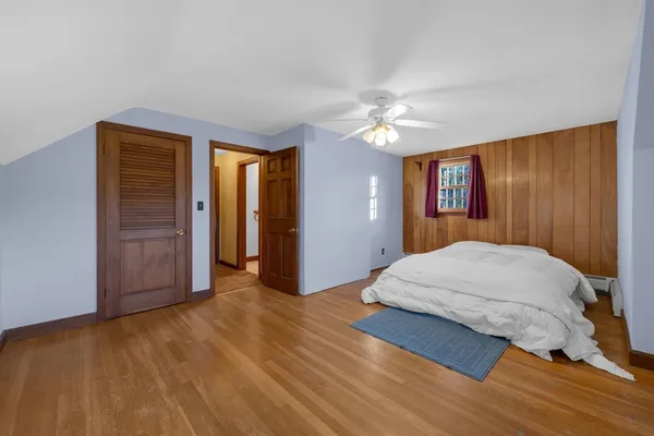 a bathroom with a toilet sink double vanity and mirror