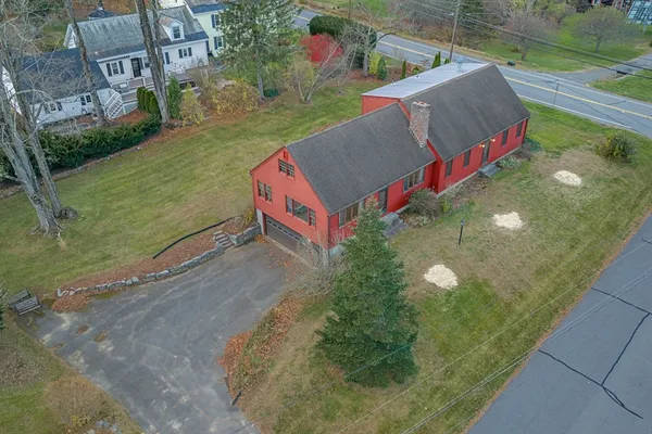 an aerial view of a house with a lake view