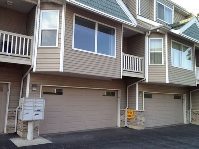 6032 Park Ridge Road, Unit 6032 Loves Park, IL 61111 - Photo 1 of 13 a view of a house with a deck
