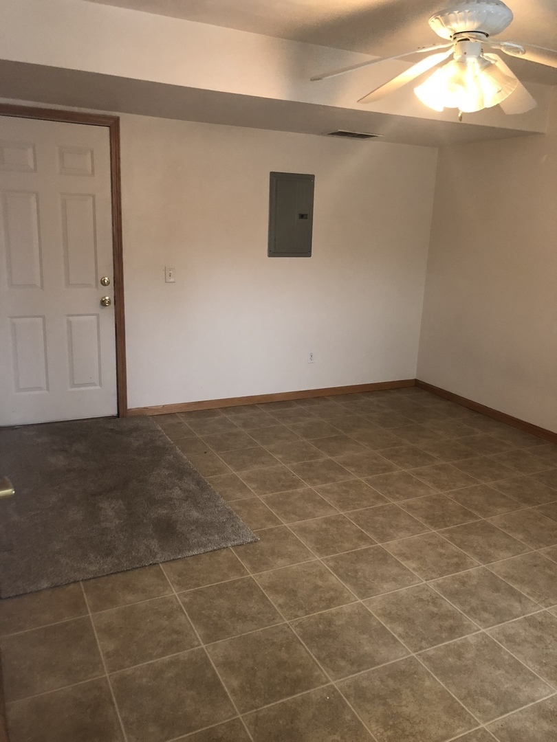 6032 Park Ridge Road, Unit 6032 Loves Park, IL 61111 - Photo 12 of 13 a view of an empty room with a window