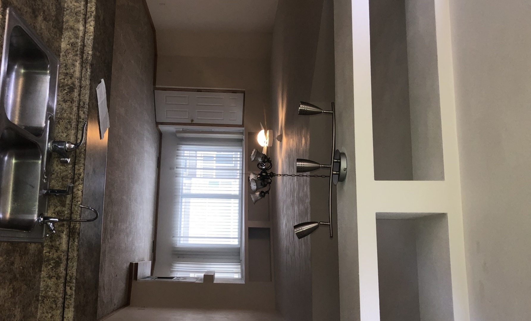 6032 Park Ridge Road, Unit 6032 Loves Park, IL 61111 - Photo 4 of 13 a bathroom with a glass door shower a sink and a mirror