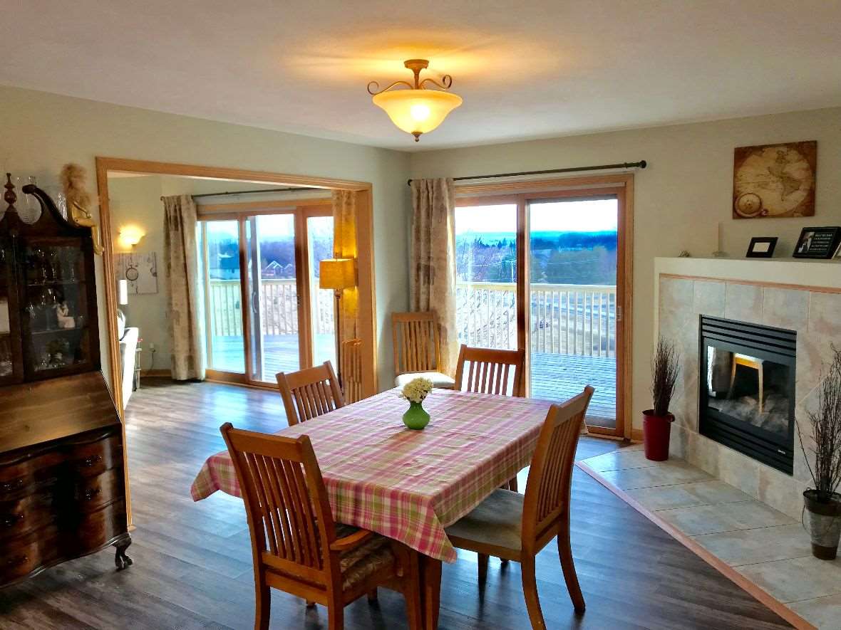9289 North Barker Road Byron, IL 61010 - Photo 8 of 25 a view of a dining room with furniture window and wooden floor
