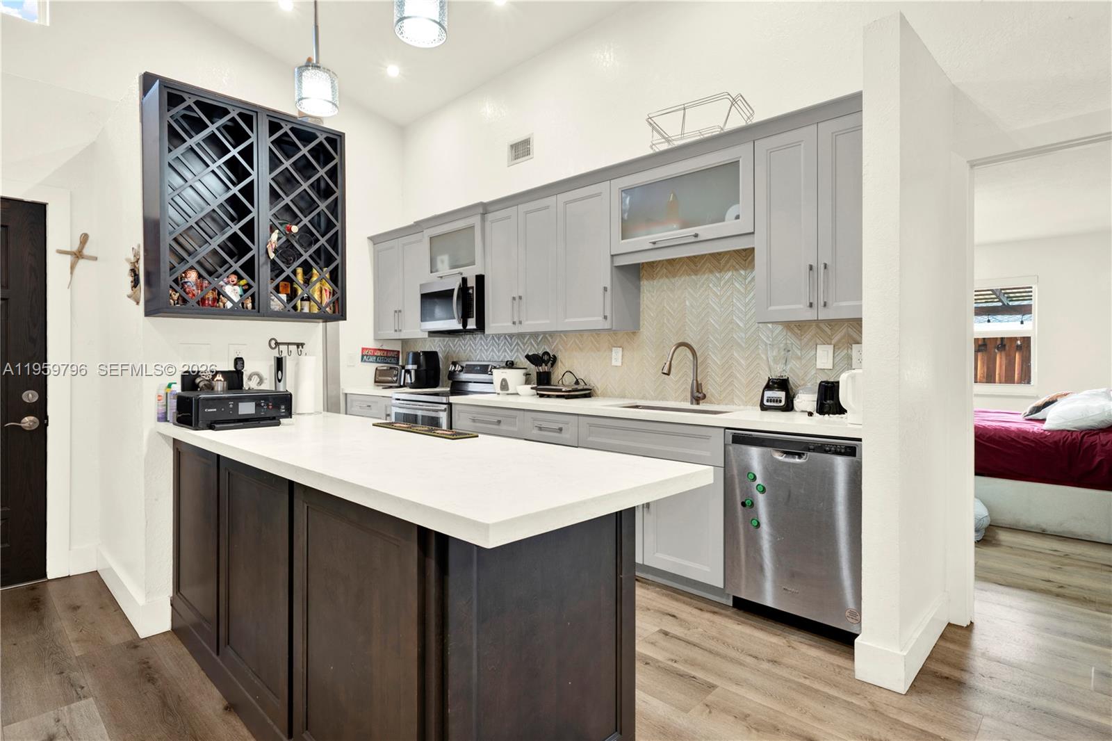 14600 Southwest 124th Place Miami, FL 33186 - Photo 6 of 34 a kitchen with stainless steel appliances a sink a stove a refrigerator and cabinets