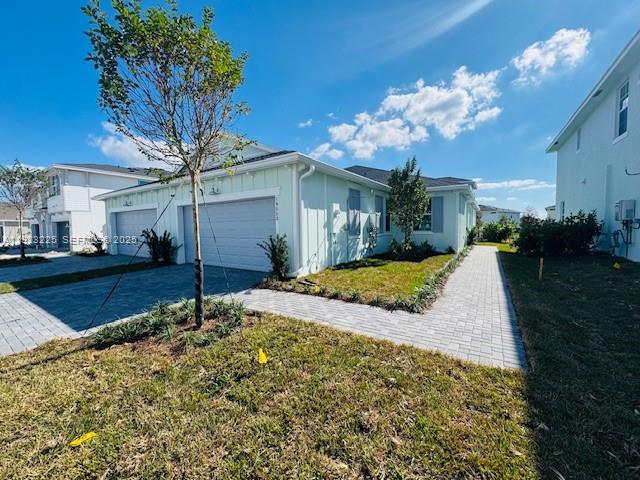 19552 Whispering Creek Road, Unit 1 West Palm Beach, FL 33470 - Photo 2 of 16 a view of a house with a yard