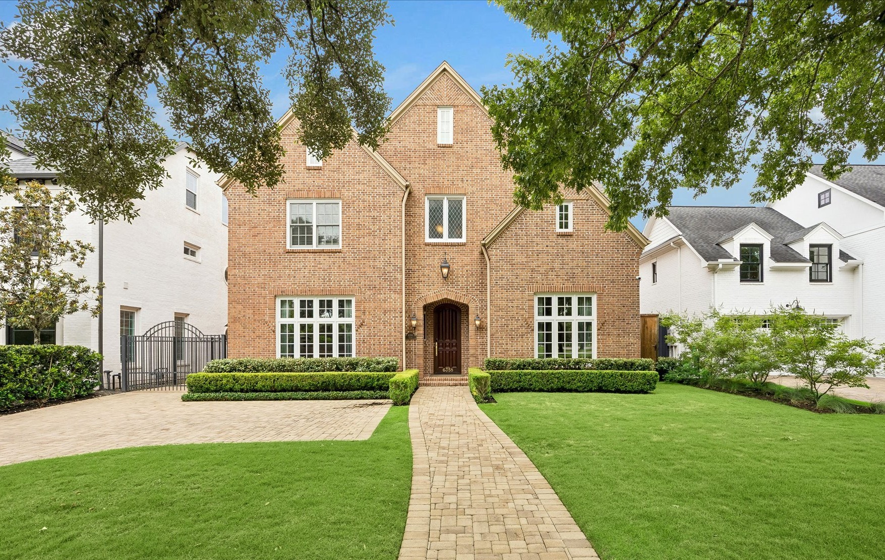 6358 Auden Street Houston, TX 77005 - Photo 1 of 50 a front view of a house with a yard