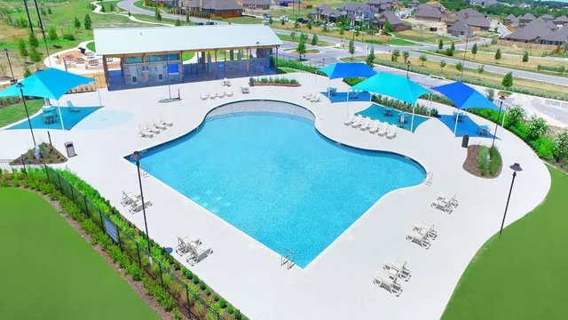 a view of a swimming pool with a garden