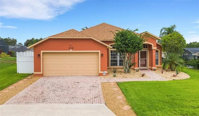 a front view of house with yard outdoor seating and barbeque oven