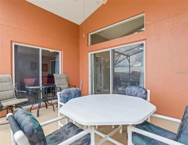a dining room with table and chairs