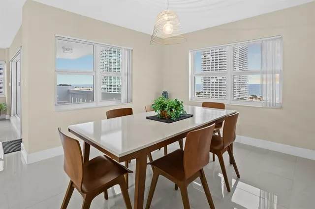 a view of a dining room with furniture and window
