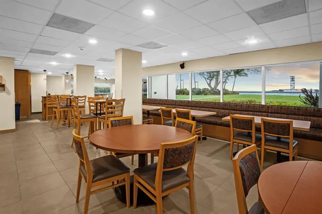 a kitchen with a table and chairs