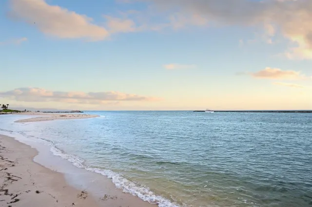 a yard with lots of green space and trees