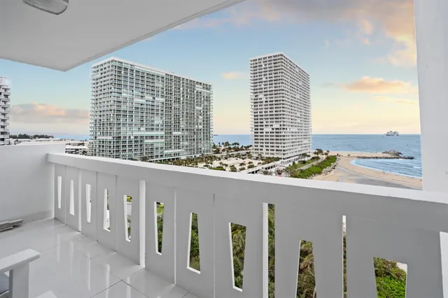 a kitchen with a refrigerator and a stove top oven