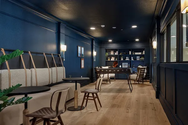 a view of a chairs and table in a room