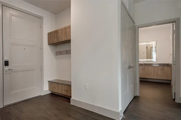 a view of a room with a wooden floor and a sink