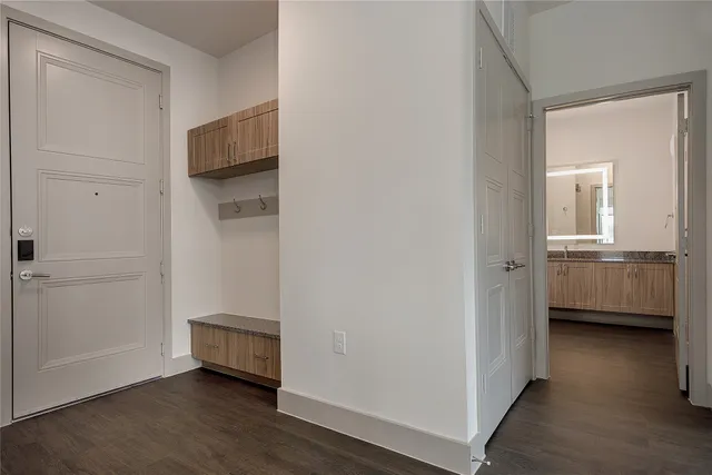 a view of a room with a wooden floor and a sink