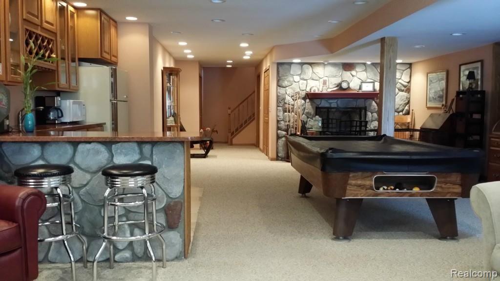 4095 Swarthout Road Howell, MI 48843 - Photo 34 of 42 Fireplace in bsmt