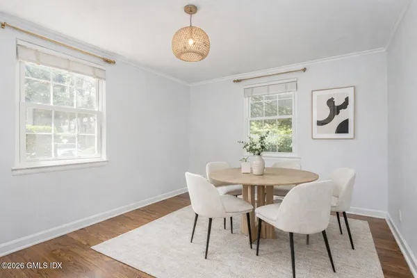 a bedroom with a bed and a table in it
