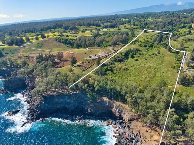 a view of a city with mountains