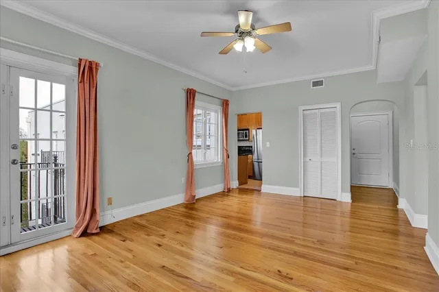 wooden floor in an empty room with a window
