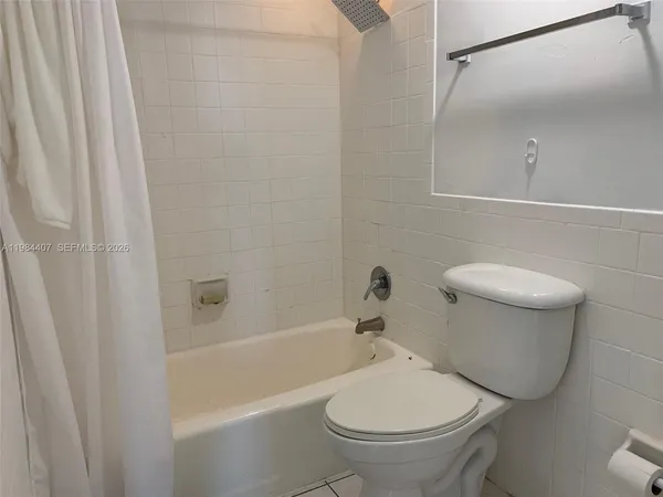 a view of bathroom with granite countertop