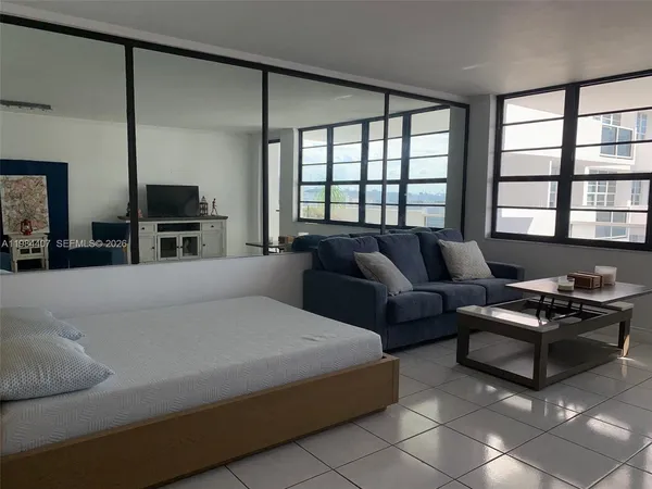 a bedroom with a bed and furniture