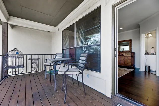 a view of a balcony with chairs