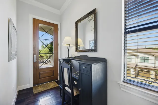 a view of an entryway with wooden floor and door