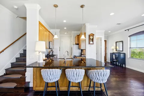 a view of an dining room and hall with furniture