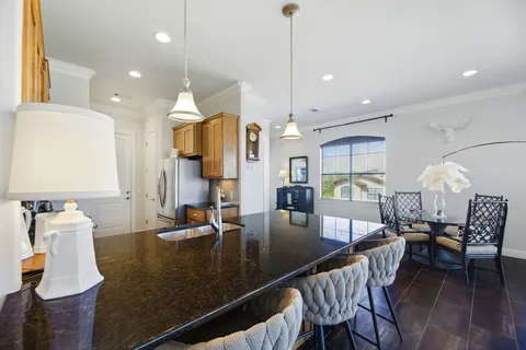 a view of kitchen and dining area with furniture