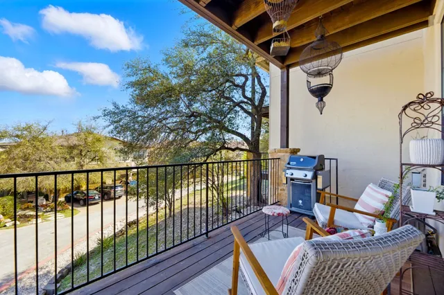 a view of balcony with furniture