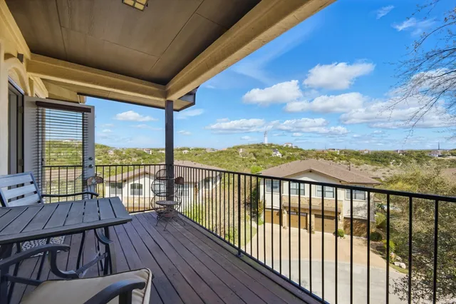 a view of balcony with wooden floor