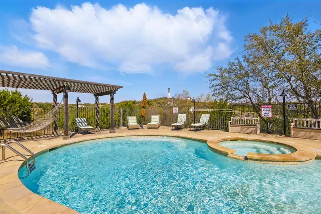 a view of a swimming pool with a patio