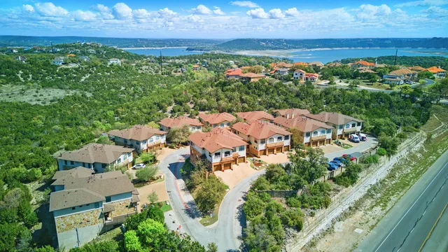 an aerial view of residential house with an outdoor space and seating
