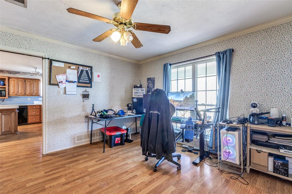 453 County Road 371 Anna, TX 75409 - Photo 17 of 26 a view of a workspace with furniture and a window