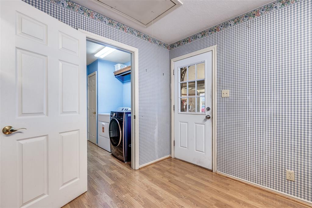 453 County Road 371 Anna, TX 75409 - Photo 19 of 26 a view of a hallway with bathroom and front door