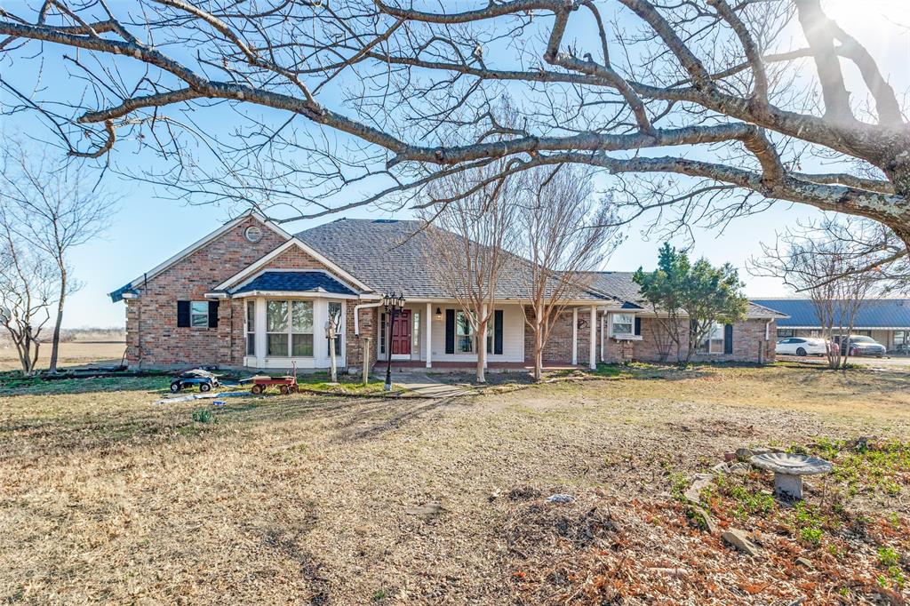 453 County Road 371 Anna, TX 75409 - Photo 4 of 26 a front view of a house with a yard and large trees