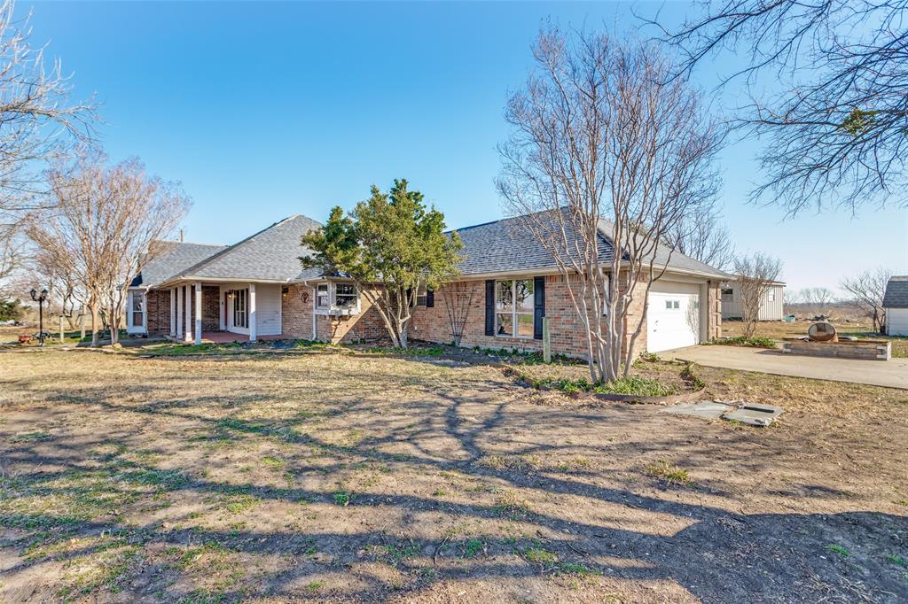 453 County Road 371 Anna, TX 75409 - Photo 5 of 26 a front view of a house with a yard