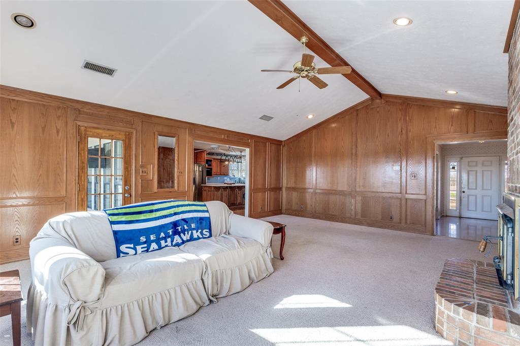 453 County Road 371 Anna, TX 75409 - Photo 9 of 26 a living room with a balcony a bed and furniture
