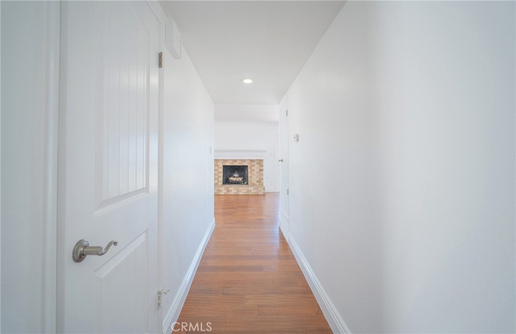 25276 Barque Way Dana Point, CA 92629 - Photo 11 of 61 a view of a hallway with wooden floor