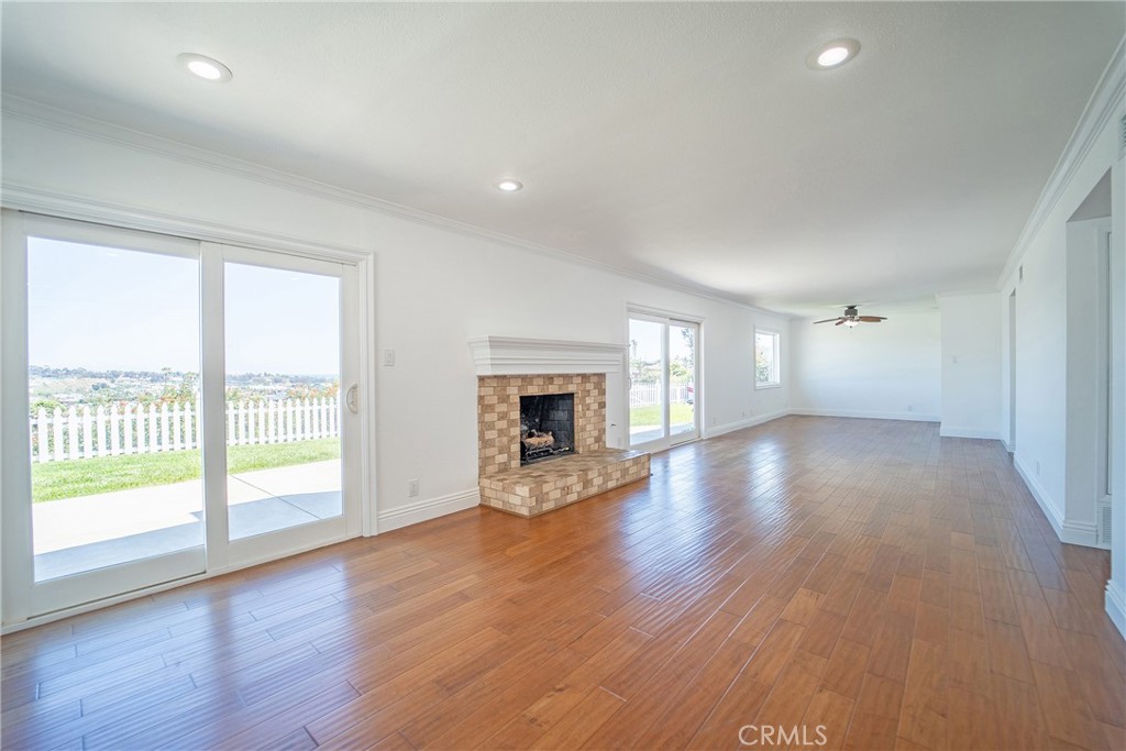 25276 Barque Way Dana Point, CA 92629 - Photo 14 of 61 a view of an empty room with wooden floor and a window