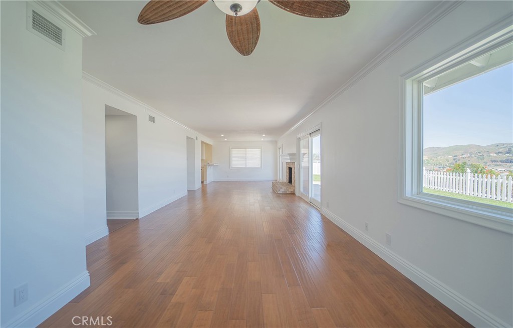 25276 Barque Way Dana Point, CA 92629 - Photo 15 of 61 a view of an empty room with wooden floor and a window