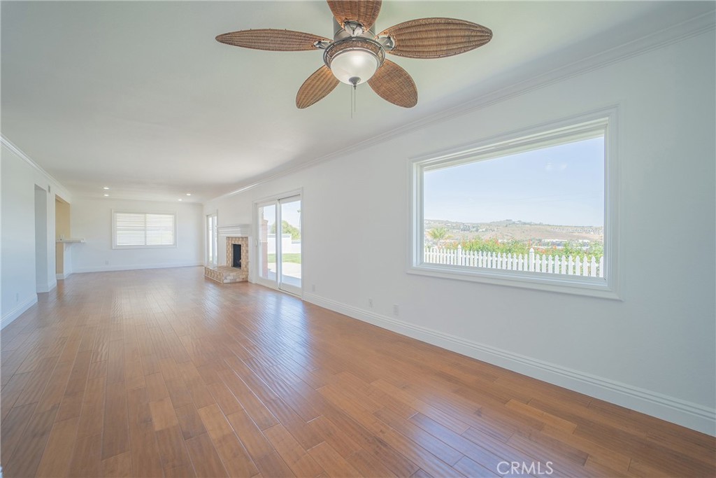 25276 Barque Way Dana Point, CA 92629 - Photo 16 of 61 a view of an empty room with wooden floor and a window
