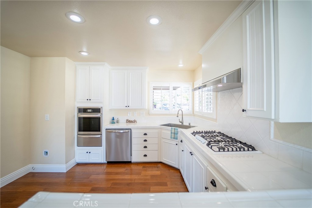 25276 Barque Way Dana Point, CA 92629 - Photo 25 of 61 a kitchen with a stove a sink and a refrigerator