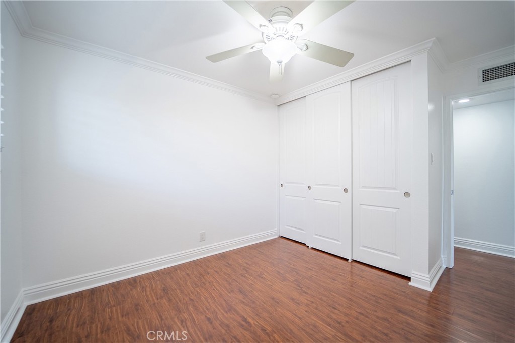 25276 Barque Way Dana Point, CA 92629 - Photo 43 of 61 an empty room with wooden floor and fan