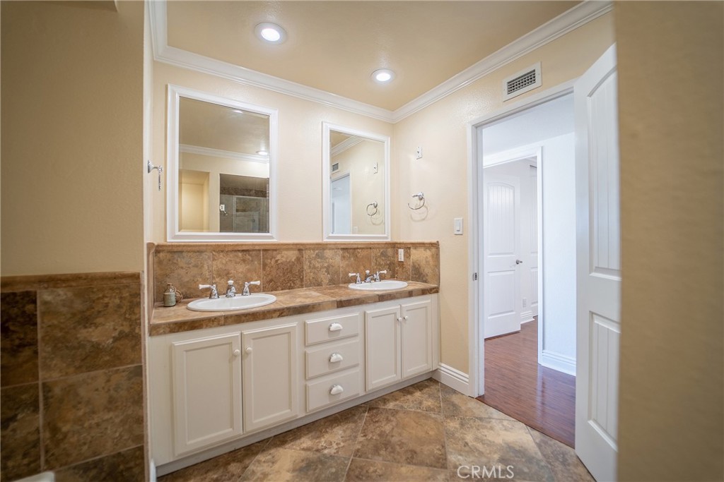 25276 Barque Way Dana Point, CA 92629 - Photo 45 of 61 a spacious bathroom with a double vanity sink a mirror and a
