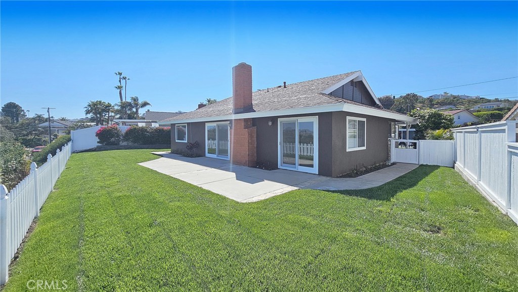 25276 Barque Way Dana Point, CA 92629 - Photo 47 of 61 a front view of a house with a garden and yard