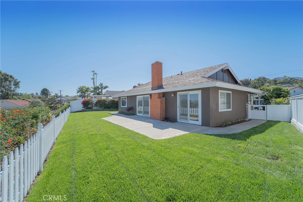 25276 Barque Way Dana Point, CA 92629 - Photo 48 of 61 a front view of a house with a garden and yard